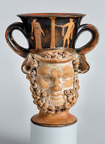 Terracotta kantharos (drinking cup with two vertical handles): heads of a satyr and a woman
