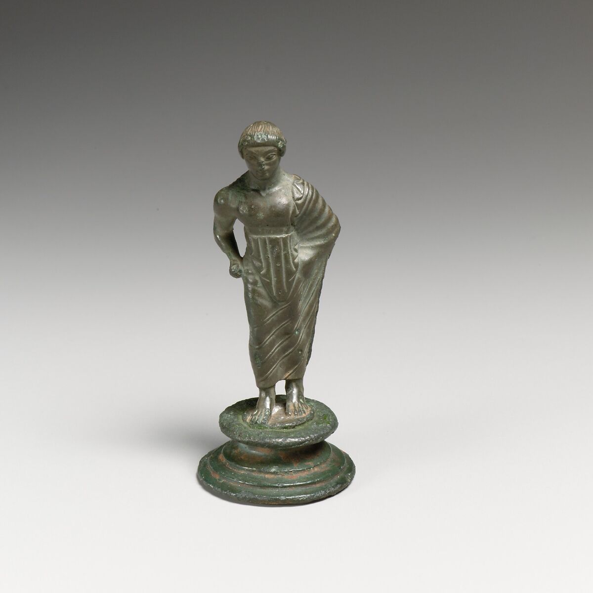 Bronze statuette of a draped youth, Bronze, Etruscan 