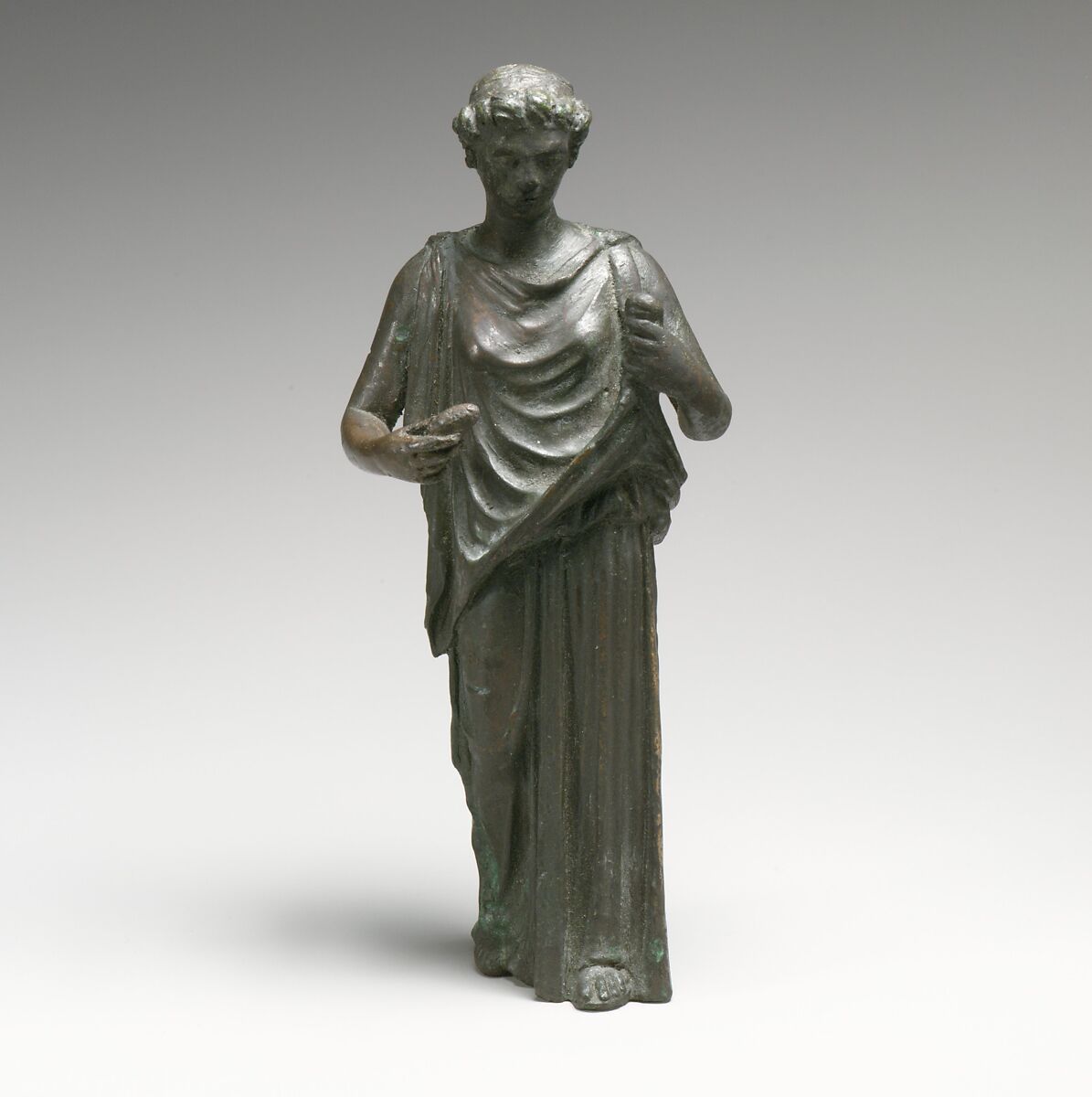 Bronze statuette of a woman, perhaps a Hesperid, Bronze, Roman 