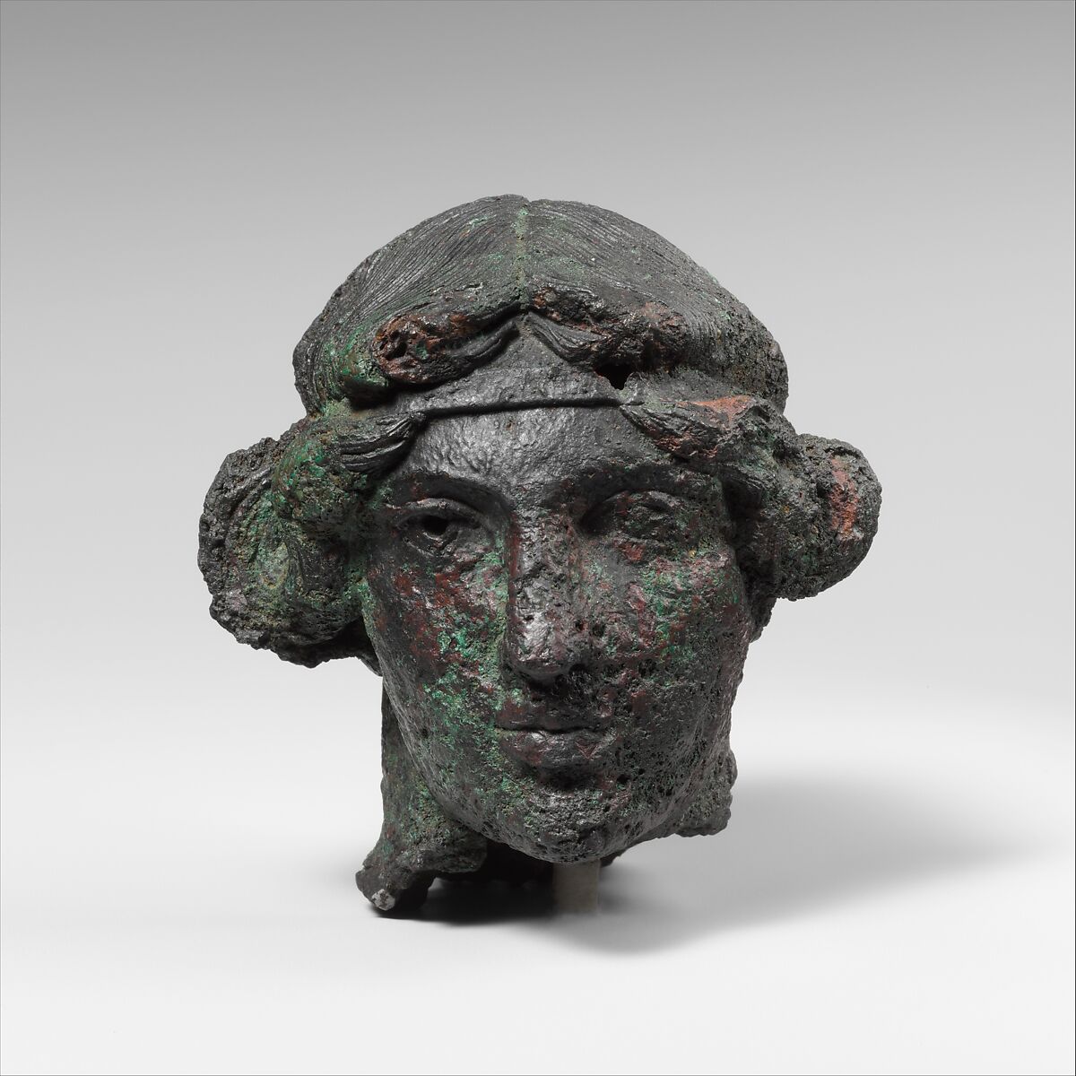 Bronze statuette of an artisan with silver eyes, Greek