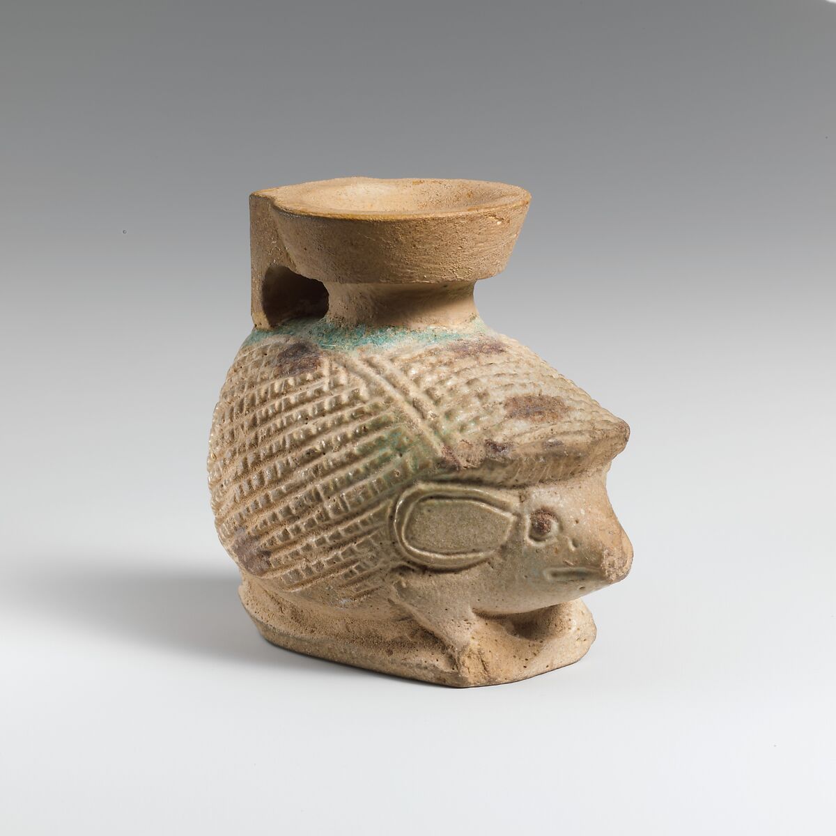 Faience aryballos (oil flask) in the form of a hedgehog, Faience, East Greek 