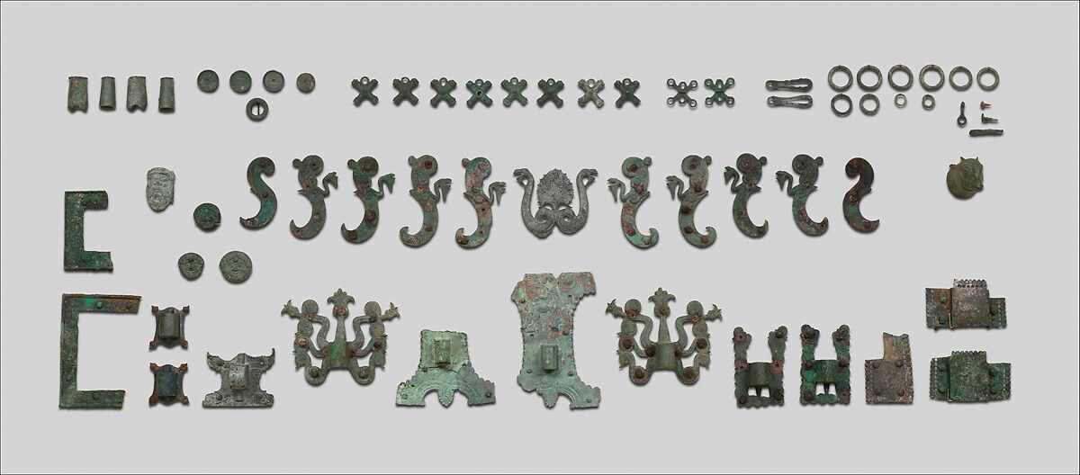 Fragment of a cart or chariot, socket with satyr mask, Bronze, Etruscan