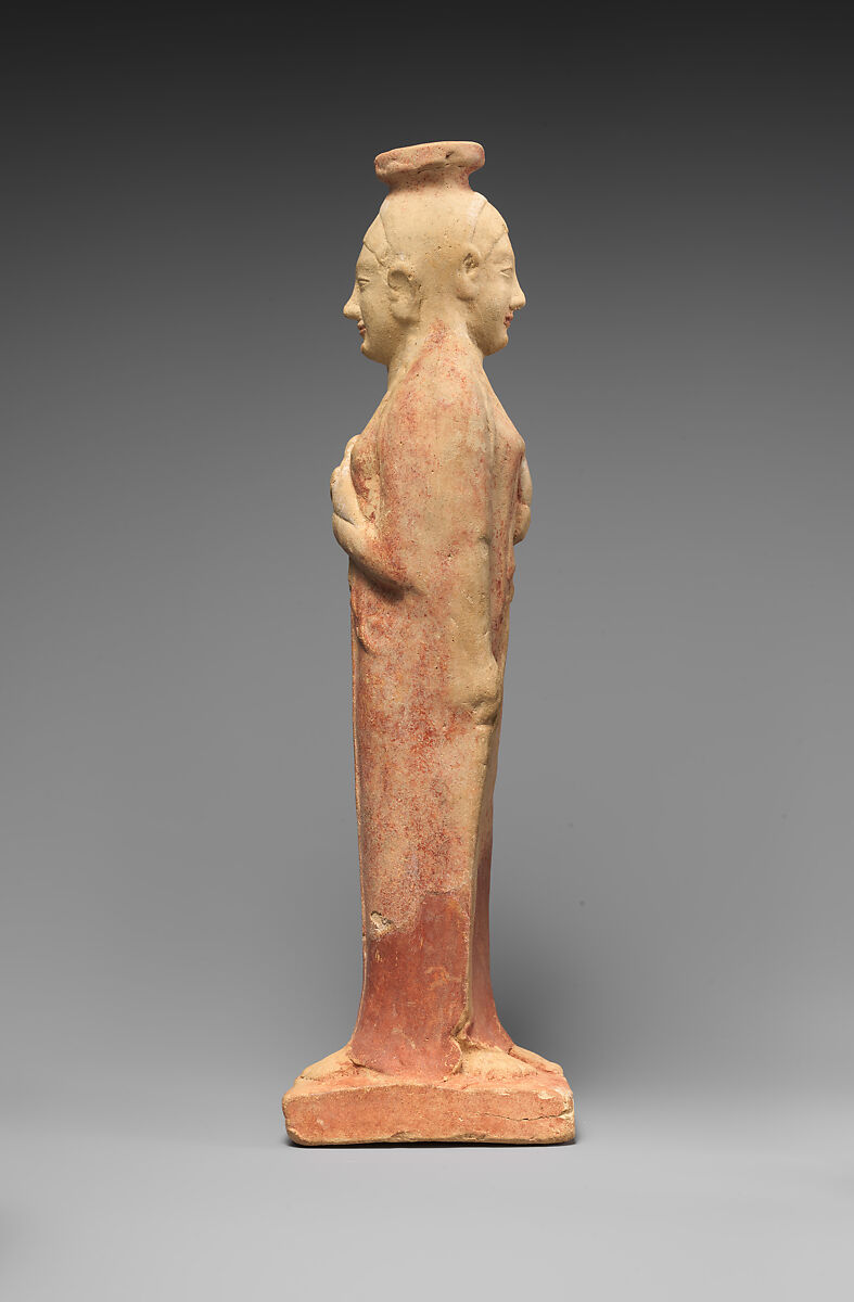 Terracotta alabastron (perfume vase) in the form of a woman holding a dove, Terracotta, East Greek
