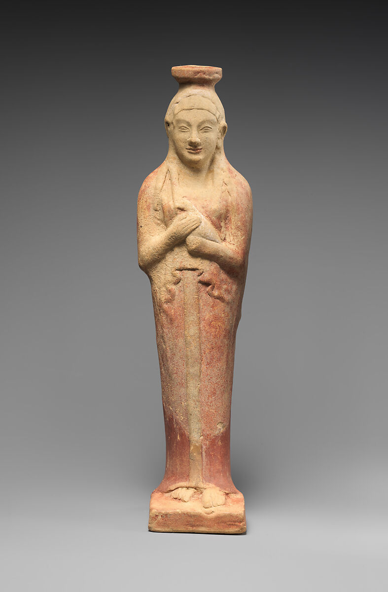 Terracotta alabastron (perfume vase) in the form of a woman holding a dove, Terracotta, East Greek
