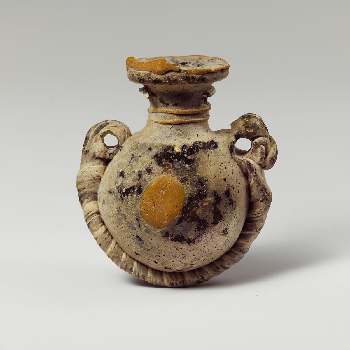 Glass lentoid aryballos (perfume bottle), Glass, Greek 