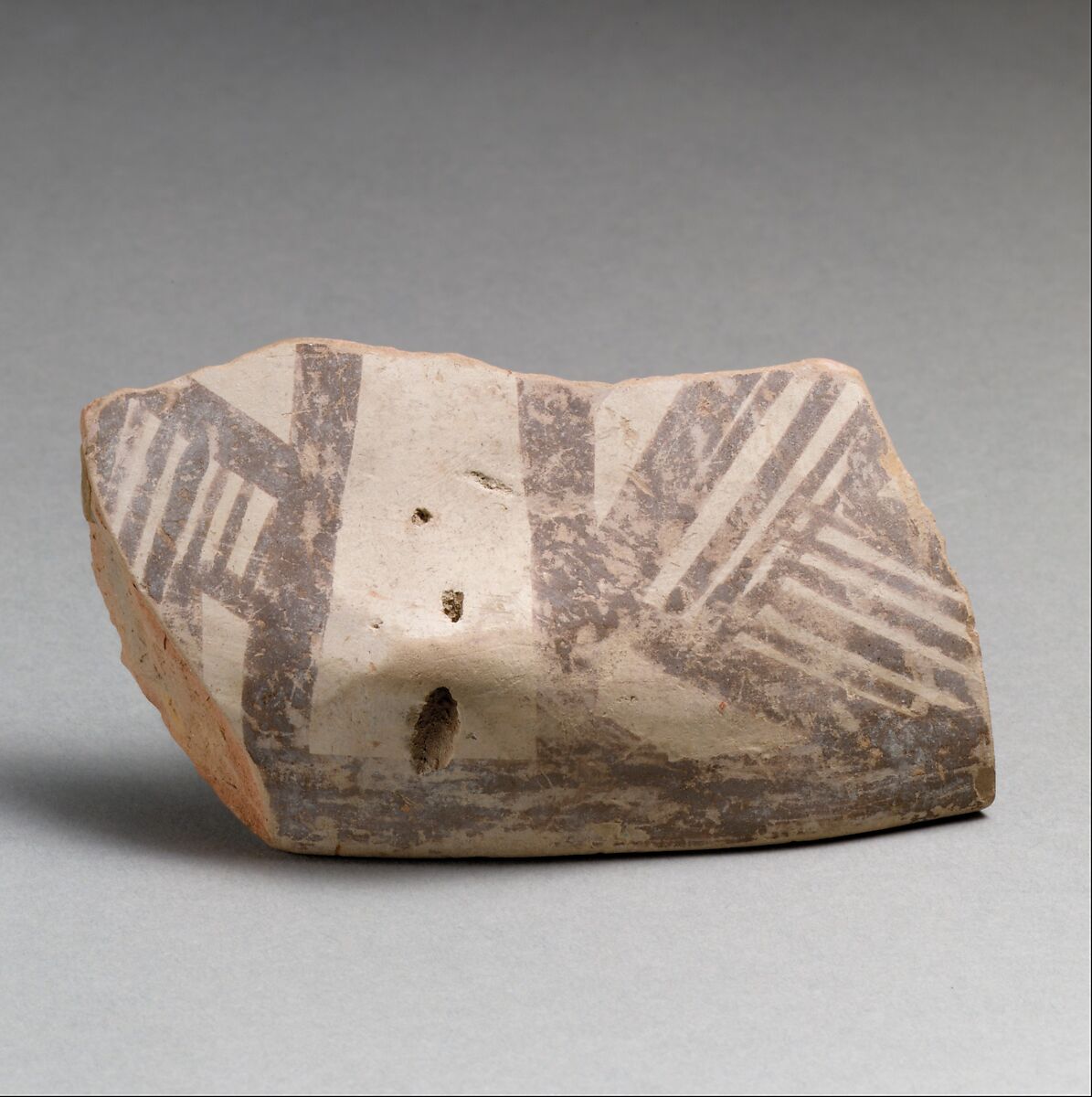 Terracotta rim fragment with lug and linear decoration, Terracotta, Dimini culture 