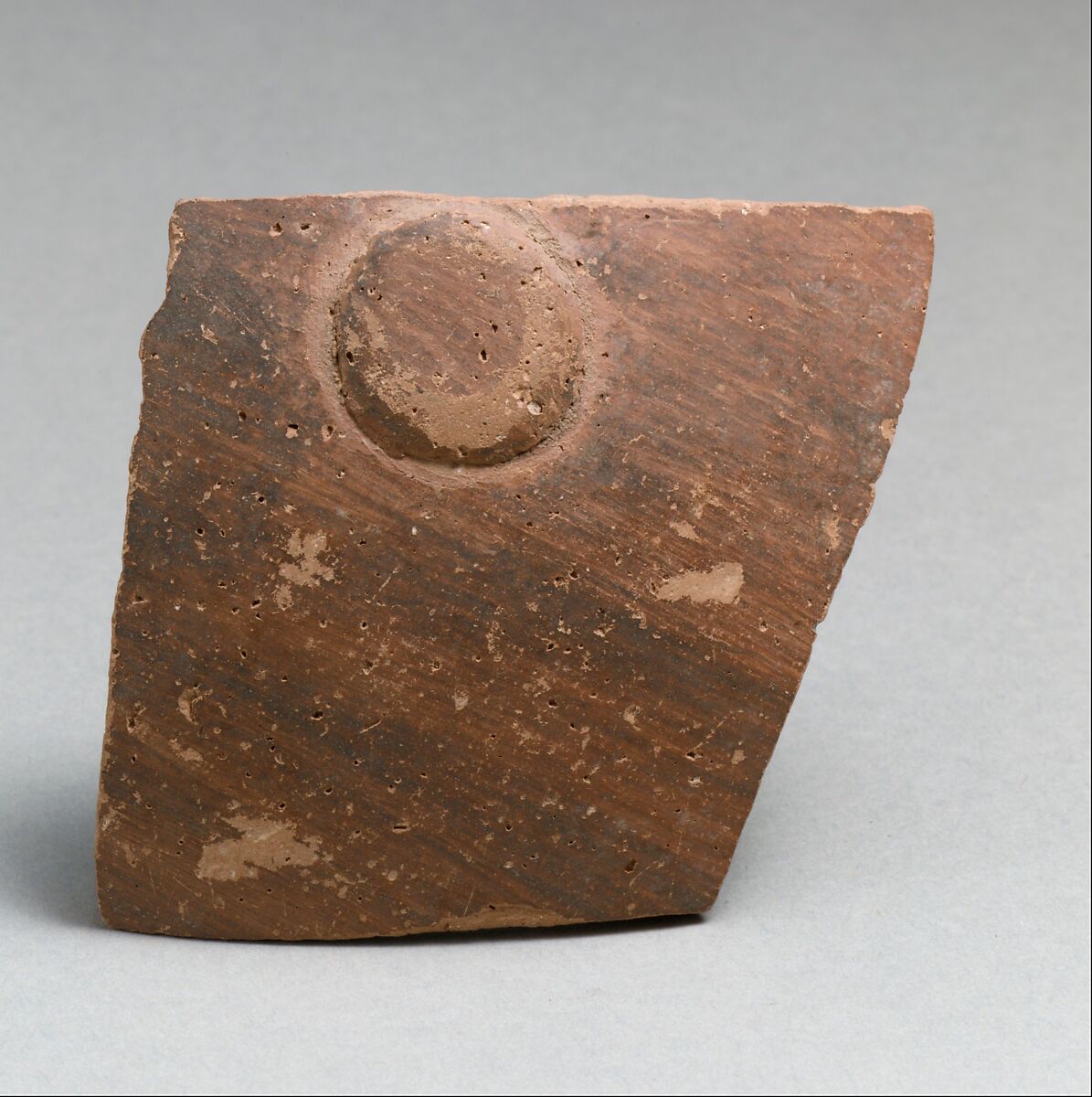 Terracotta vessel fragment with boss, Terracotta, Greek Neolithic 