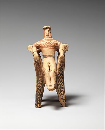 Terracotta figure in an armchair