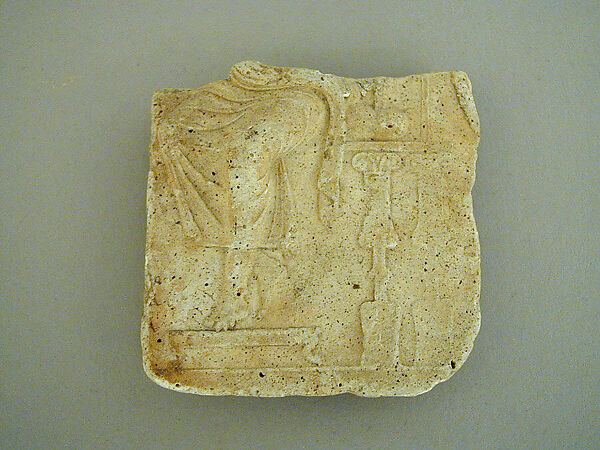 Plaster relief fragment with a male figure on a throne