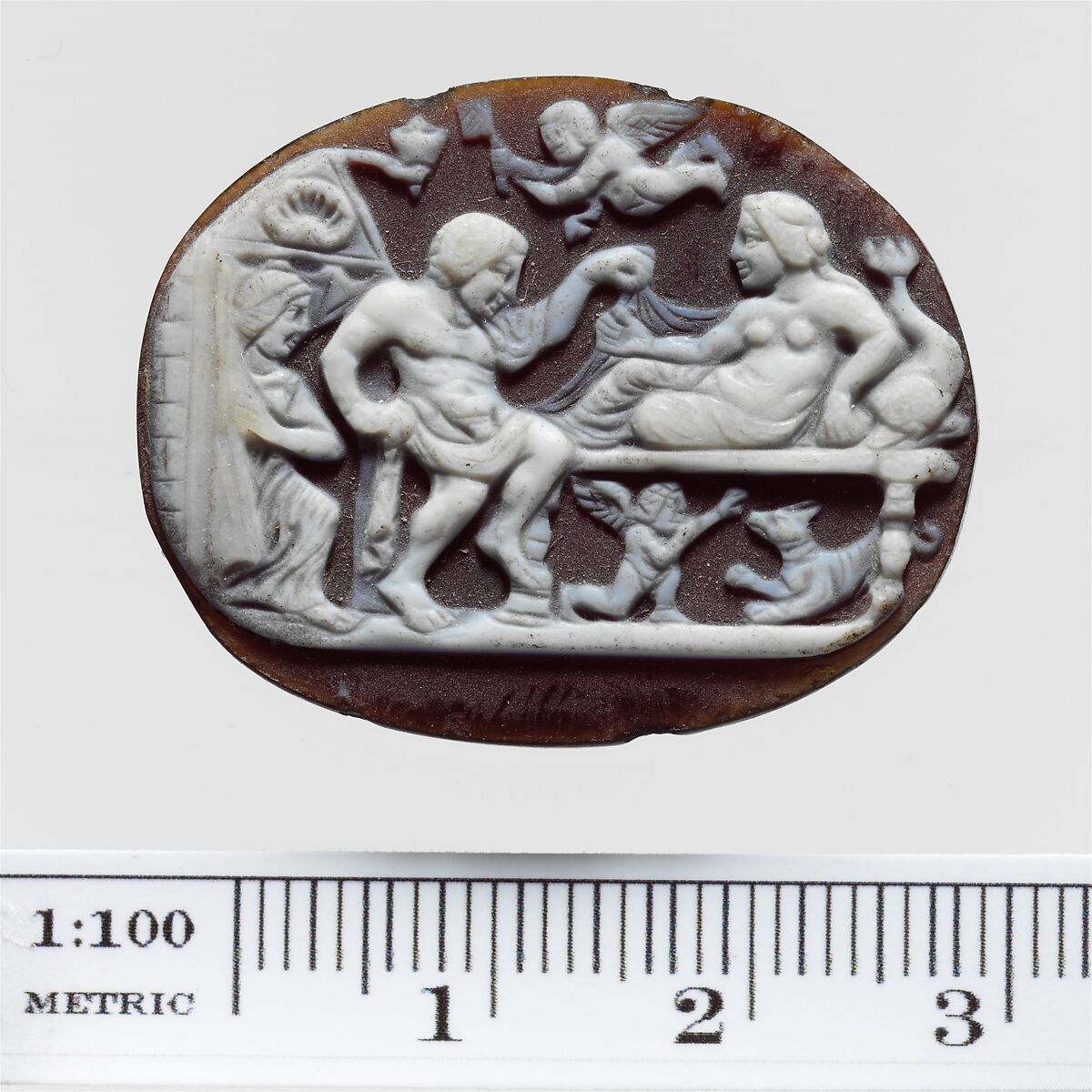 Sardonyx cameo with a man and woman on a couch, Sardonyx, Greek or Roman 