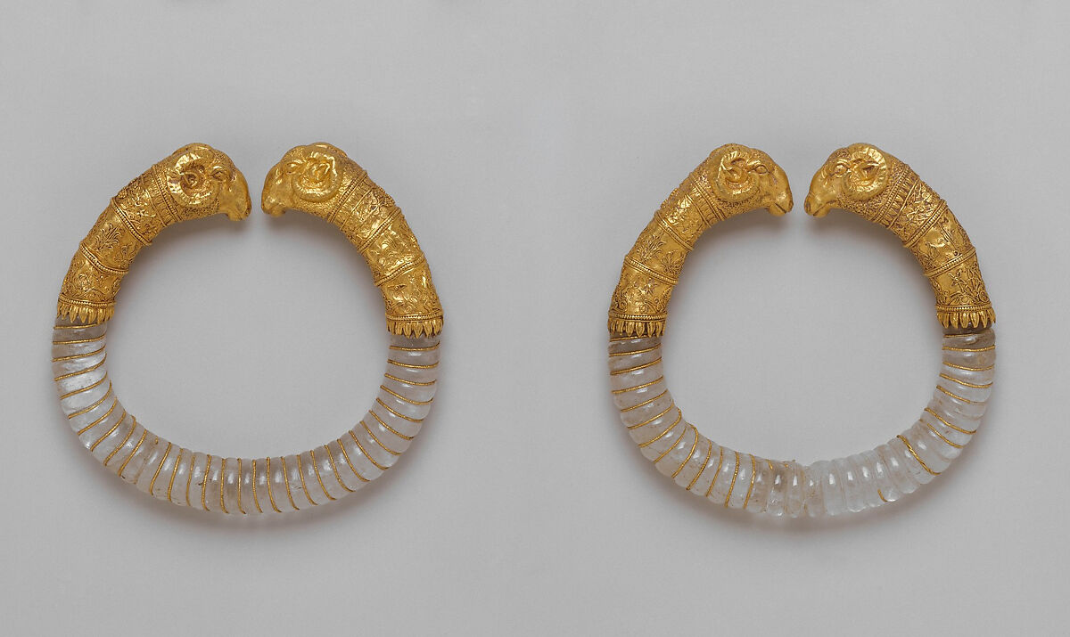 Pair of bracelets with rock crystal hoops and gold rams' heads, Greek, Hellenistic