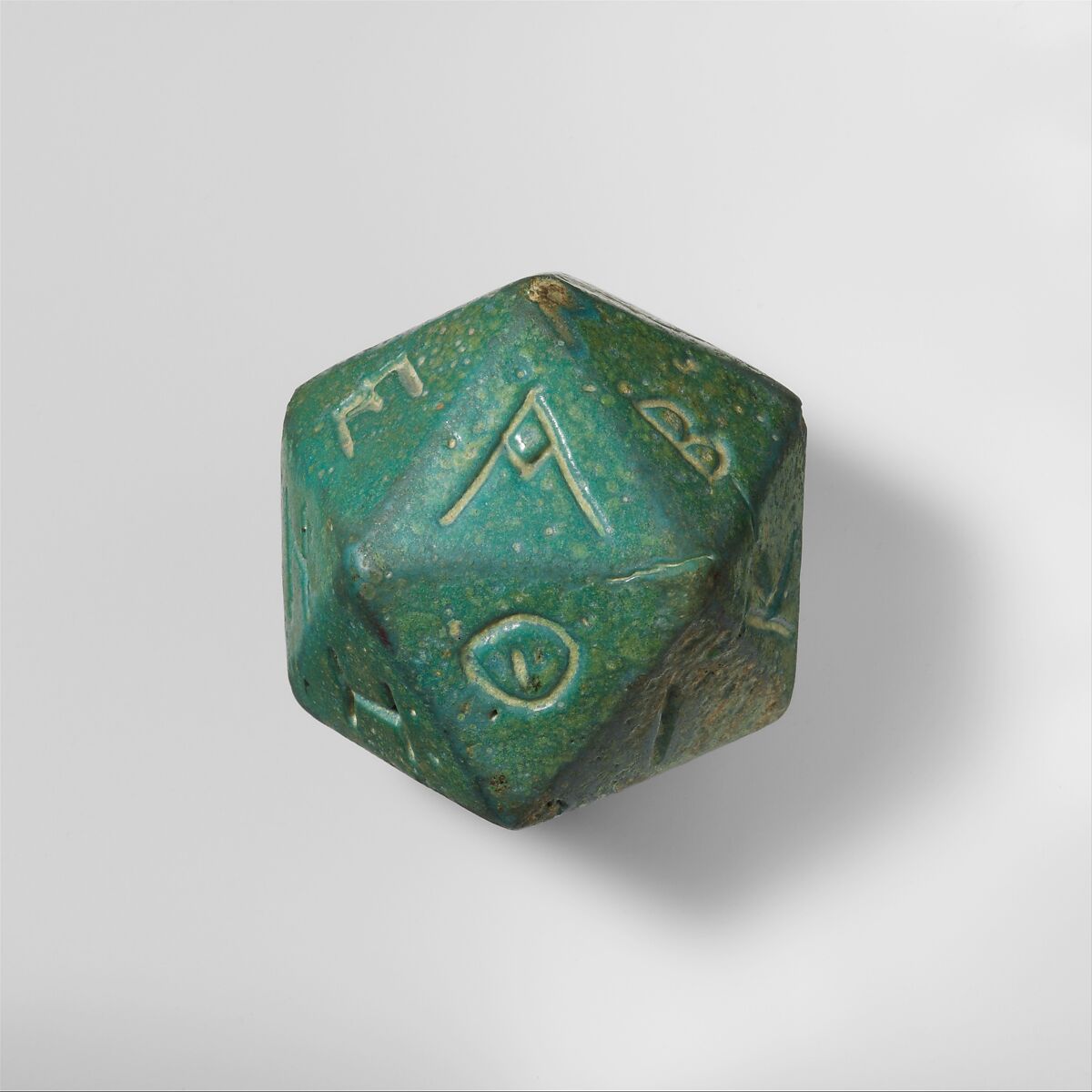 Faience polyhedron inscribed with letters of the Greek alphabet, Faience, Roman 