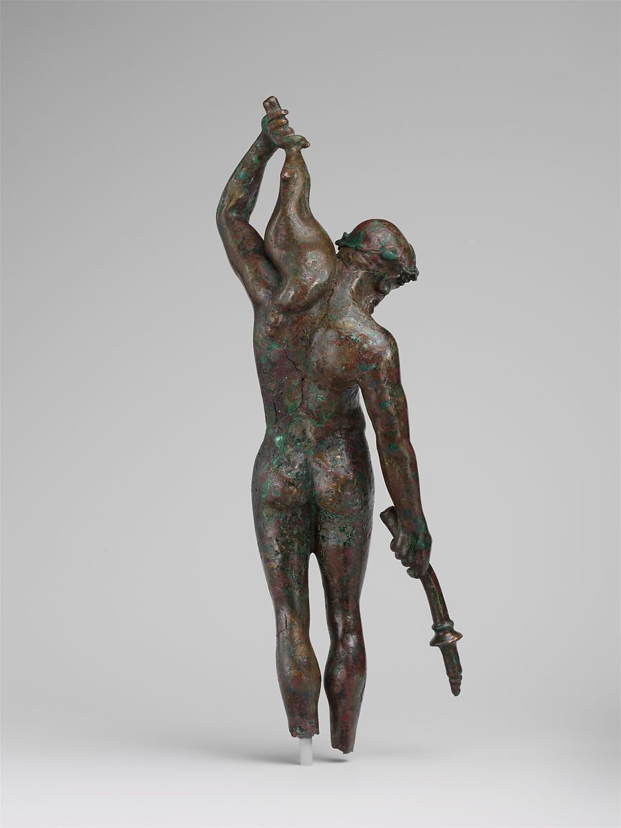 Bronze statuette of a satyr with a torch and wineskin, Bronze, Greek