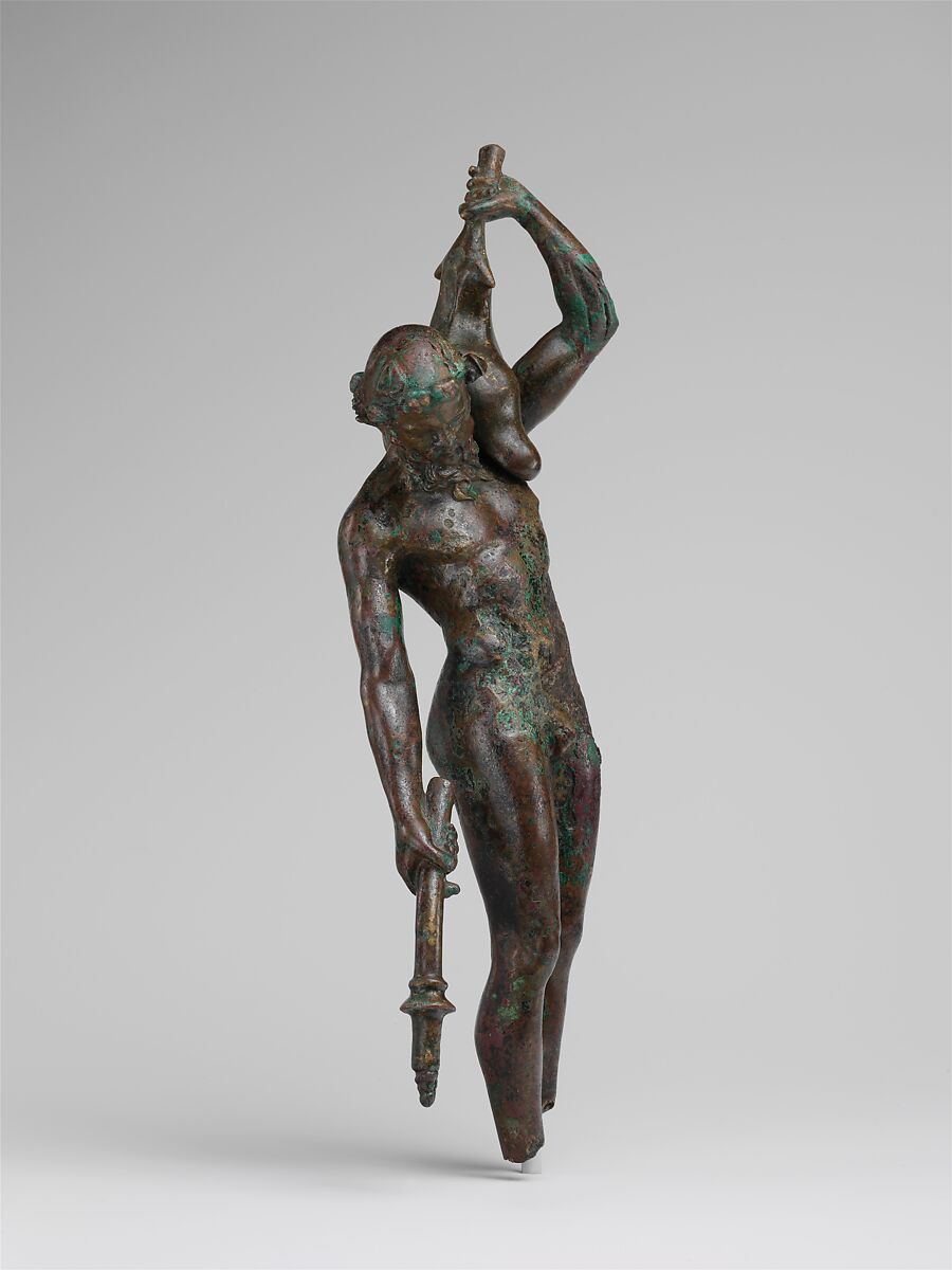 Bronze statuette of a satyr with a torch and wineskin, Bronze, Greek