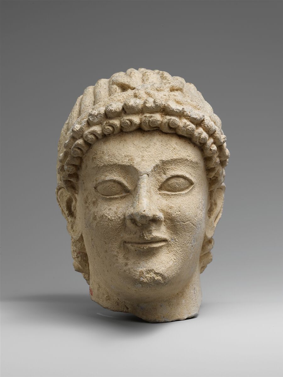 Limestone head of a wreathed youth, Limestone, Cypriot 