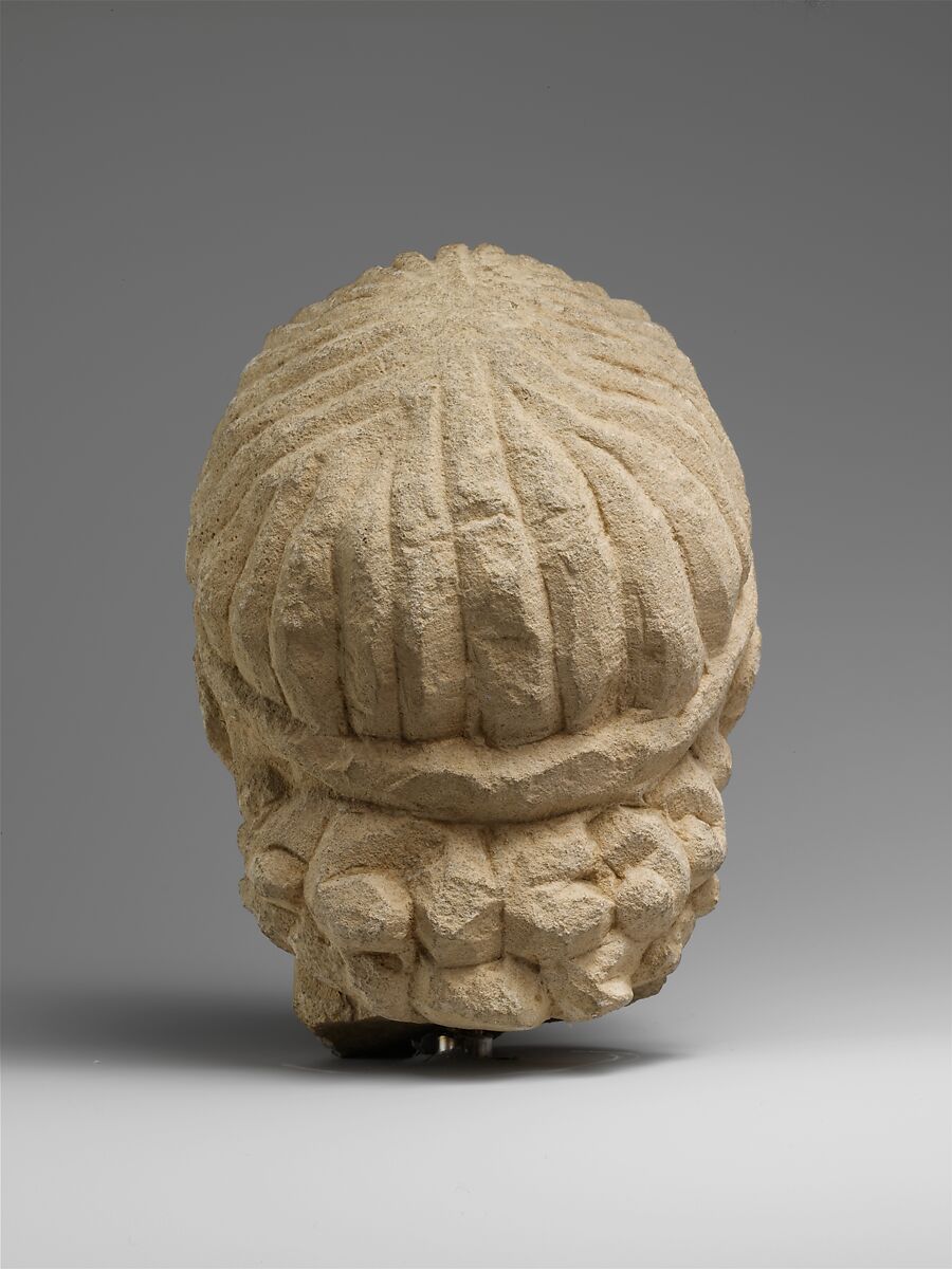 Limestone head of a wreathed youth, Limestone, Cypriot