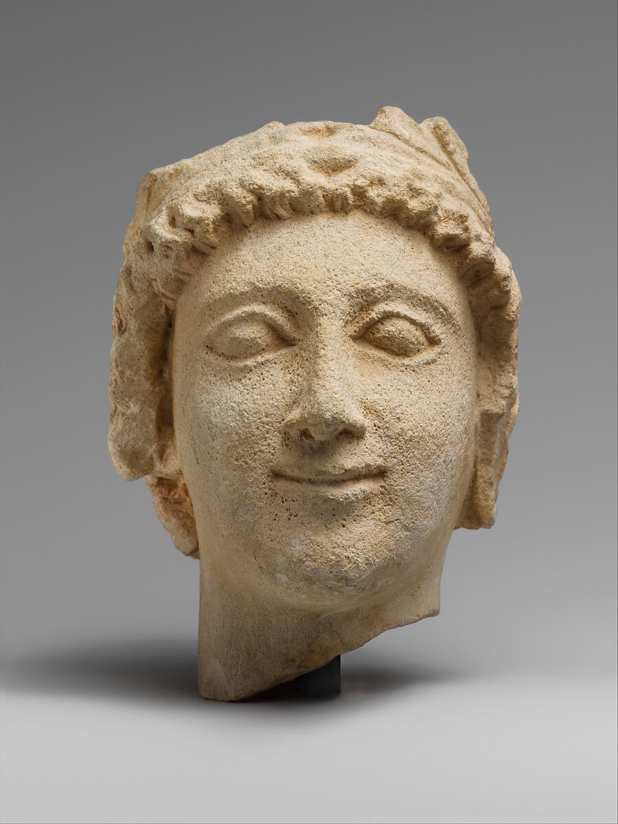 Limestone head of a wreathed youth, Limestone, Cypriot 