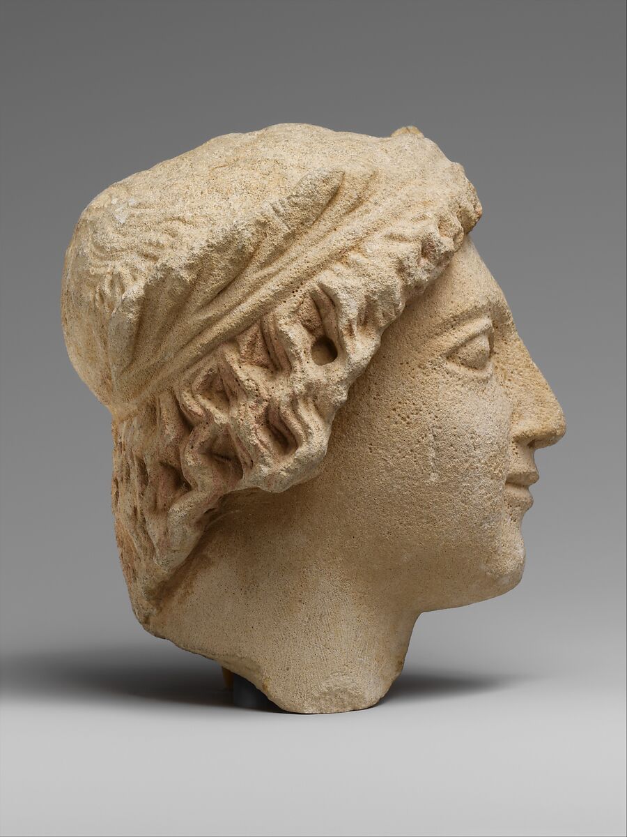 Limestone head of a wreathed youth, Limestone, Cypriot
