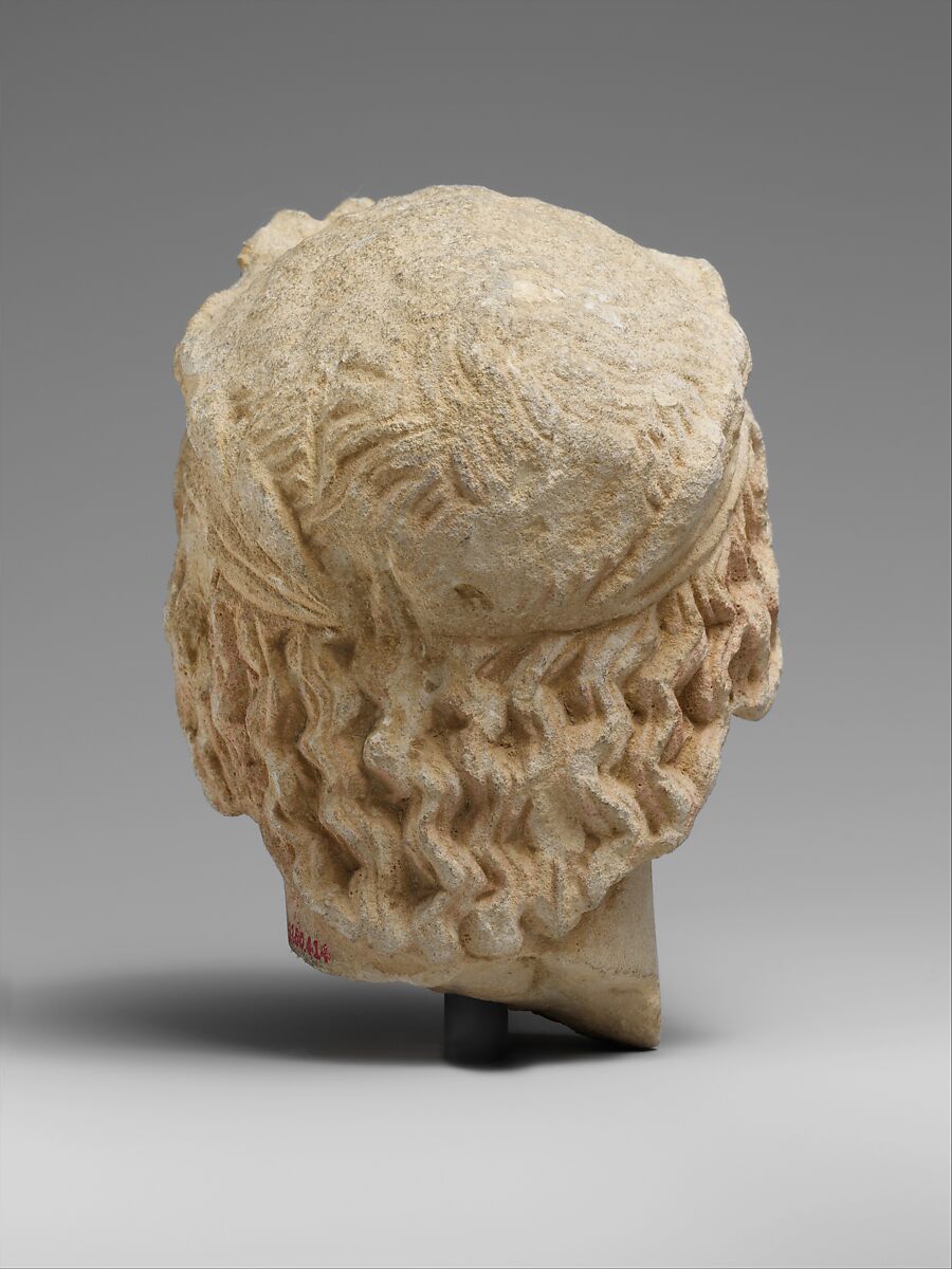 Limestone head of a wreathed youth, Limestone, Cypriot