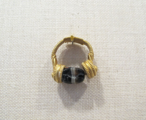 Gold swivel ring with banded agate scarab