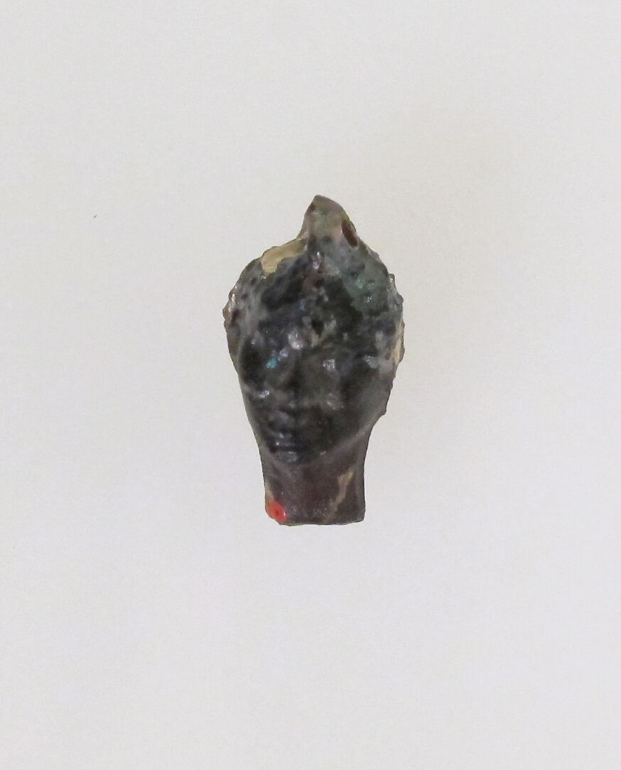 Glass pendant in the form of a Black African's head, Glass, Greek, Eastern Mediterranean