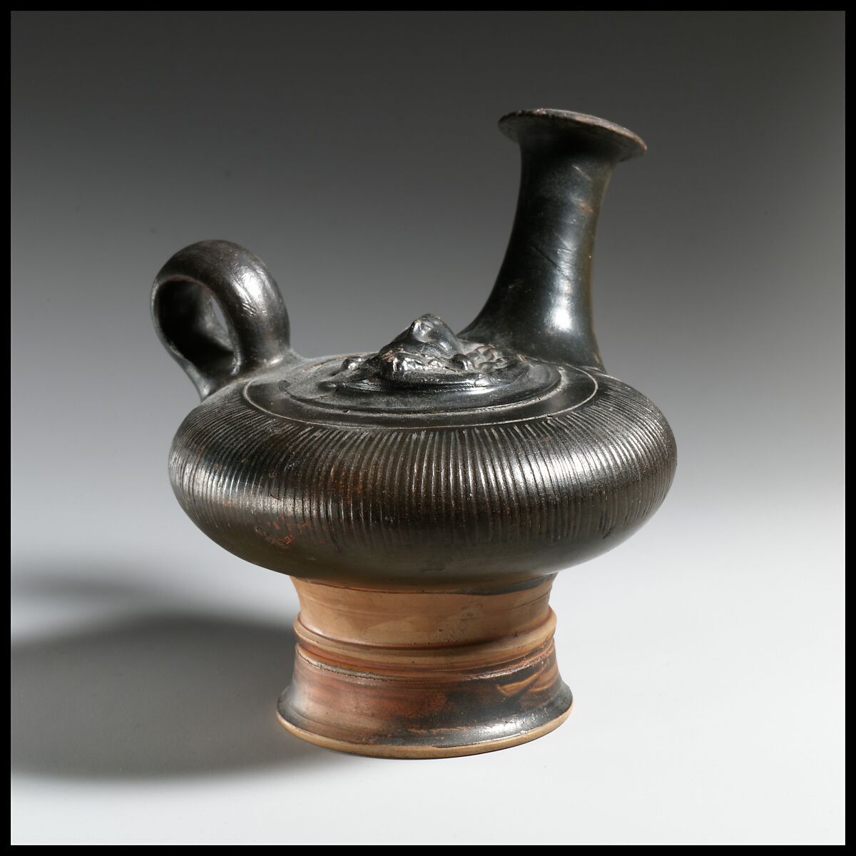Terracotta guttus (flask with handle and vertical spout)
