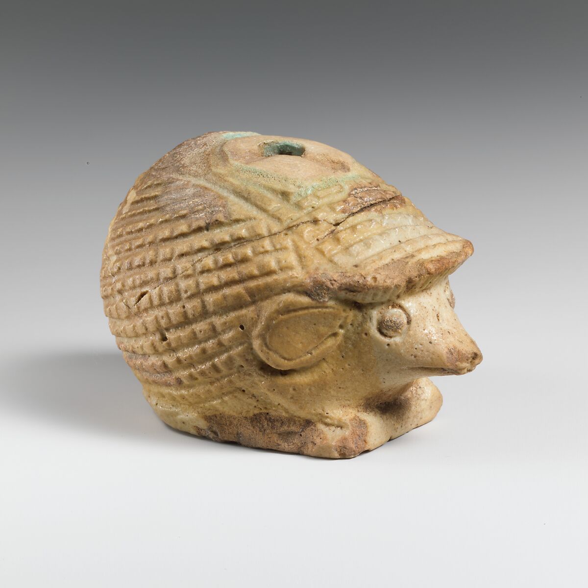 Faience aryballos (oil flask) in the form of a hedgehog, Faience, East Greek 