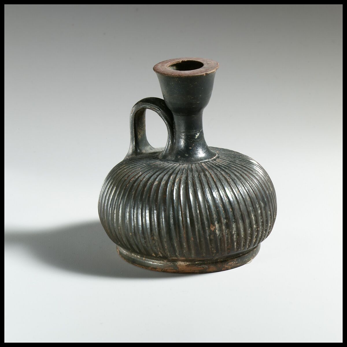 Terracotta squat lekythos (oil flask), Terracotta, Greek, South Italian, Campanian 