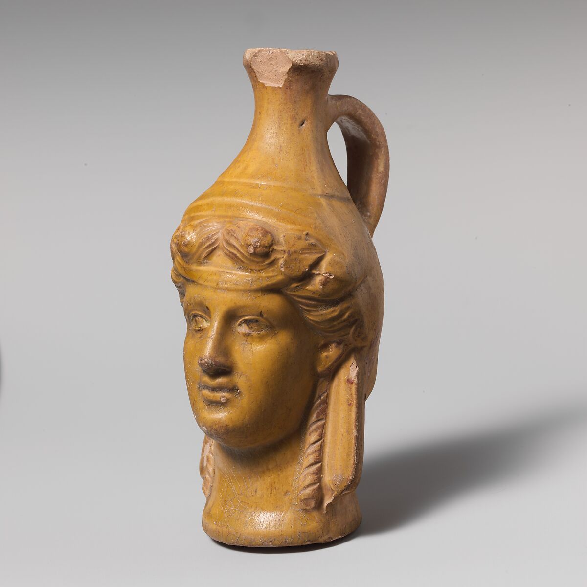 Terracotta jug in the form of Dionysos, Terracotta, Greek or Roman 