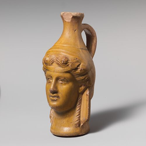 Terracotta jug in the form of Dionysos