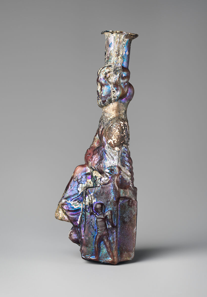 Glass bottle in the form of Tyche (Good Fortune), Glass, Roman