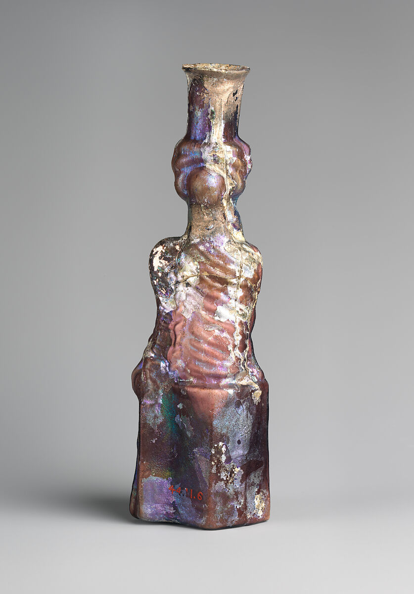 Glass bottle in the form of Tyche (Good Fortune), Glass, Roman