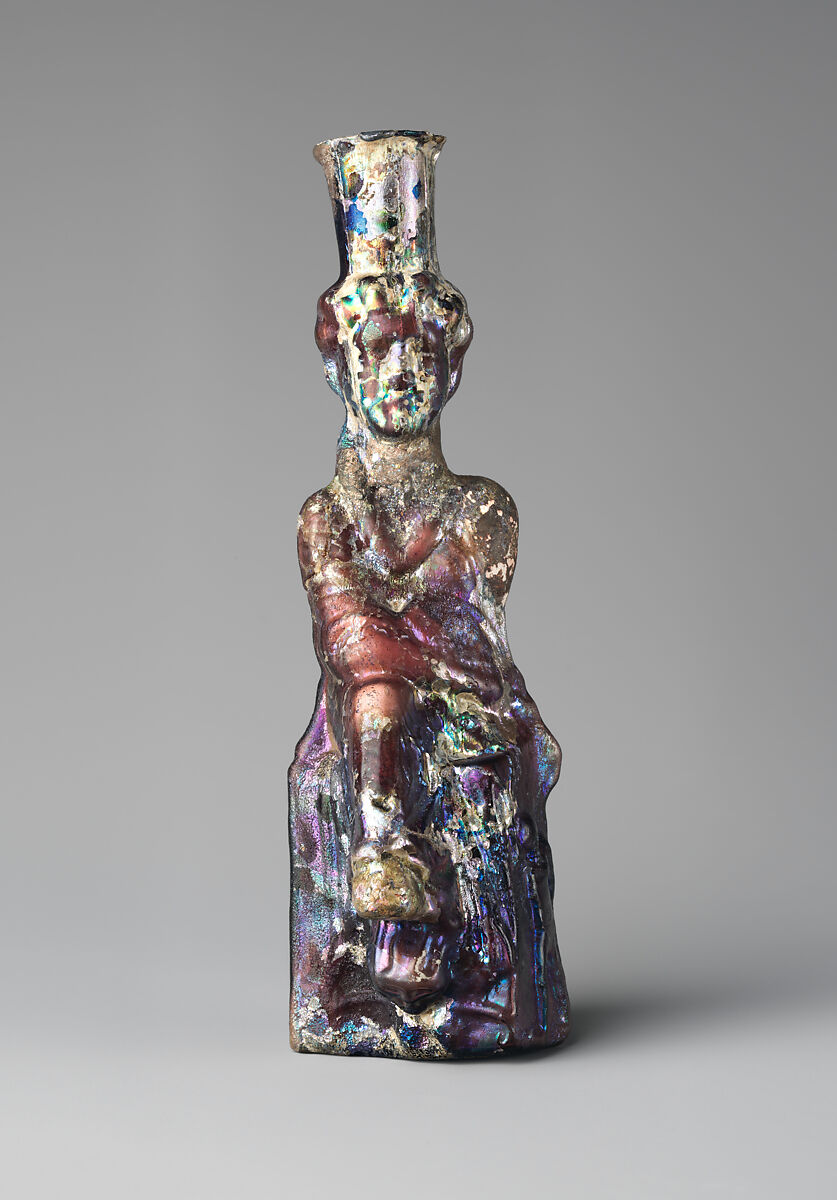 Glass bottle in the form of Tyche (Good Fortune), Glass, Roman 