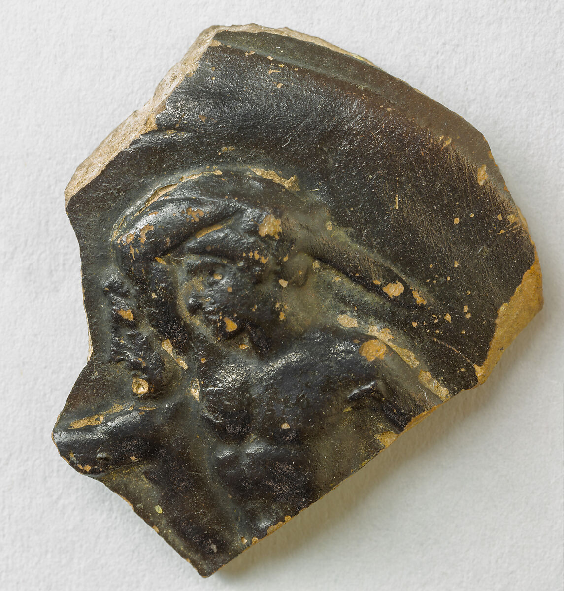 Fragment of a terracotta guttus (oil flask), Terracotta, Greek, South Italian, Campanian 