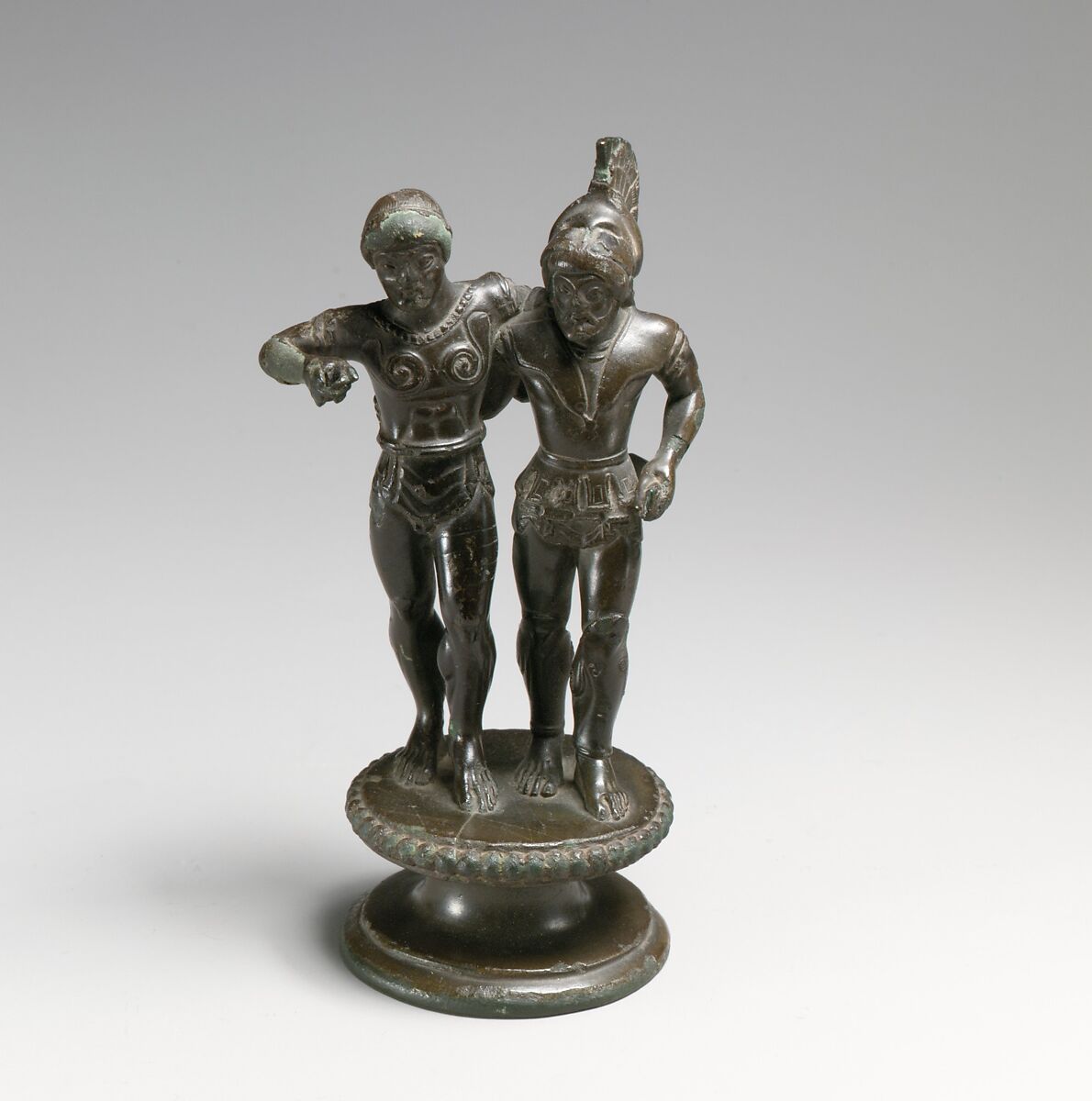 Bronze finial of two warriors from a candelabrum, Bronze, Etruscan