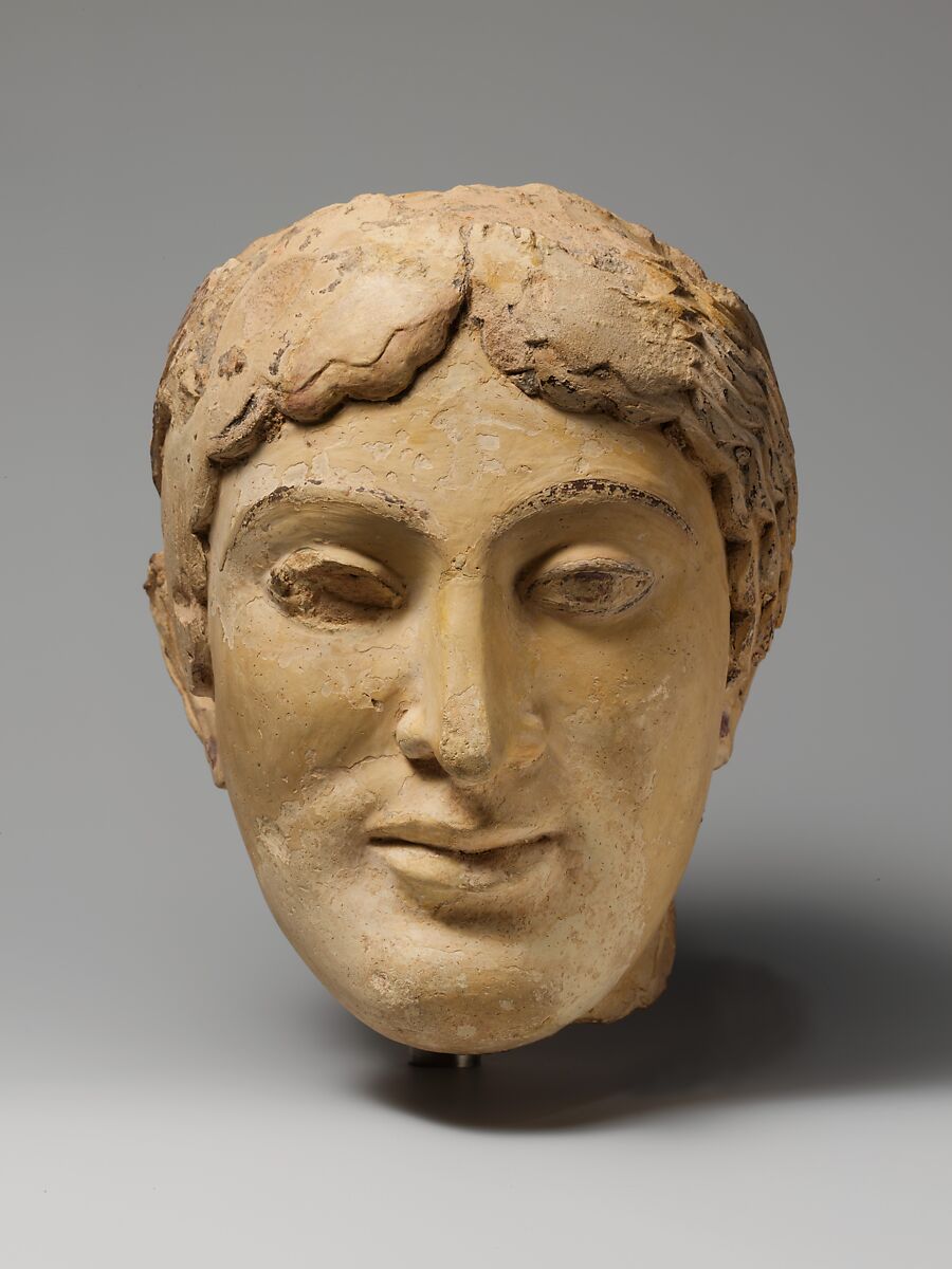 Terracotta head of a woman, probably a sphinx, Terracotta, Greek