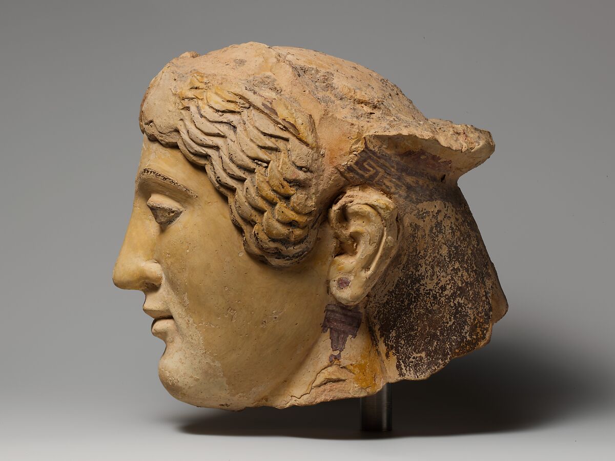 Terracotta head of a woman, probably a sphinx, Terracotta, Greek