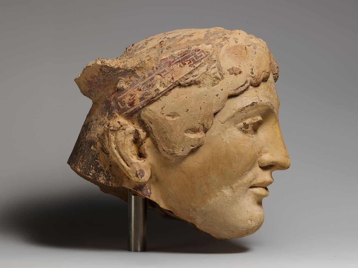 Terracotta head of a woman, probably a sphinx, Terracotta, Greek