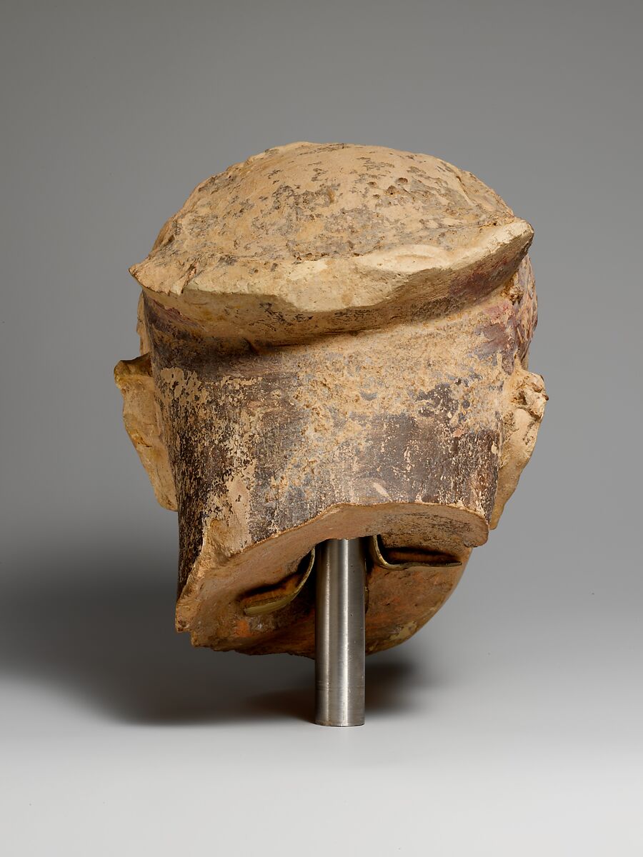 Terracotta head of a woman, probably a sphinx, Terracotta, Greek