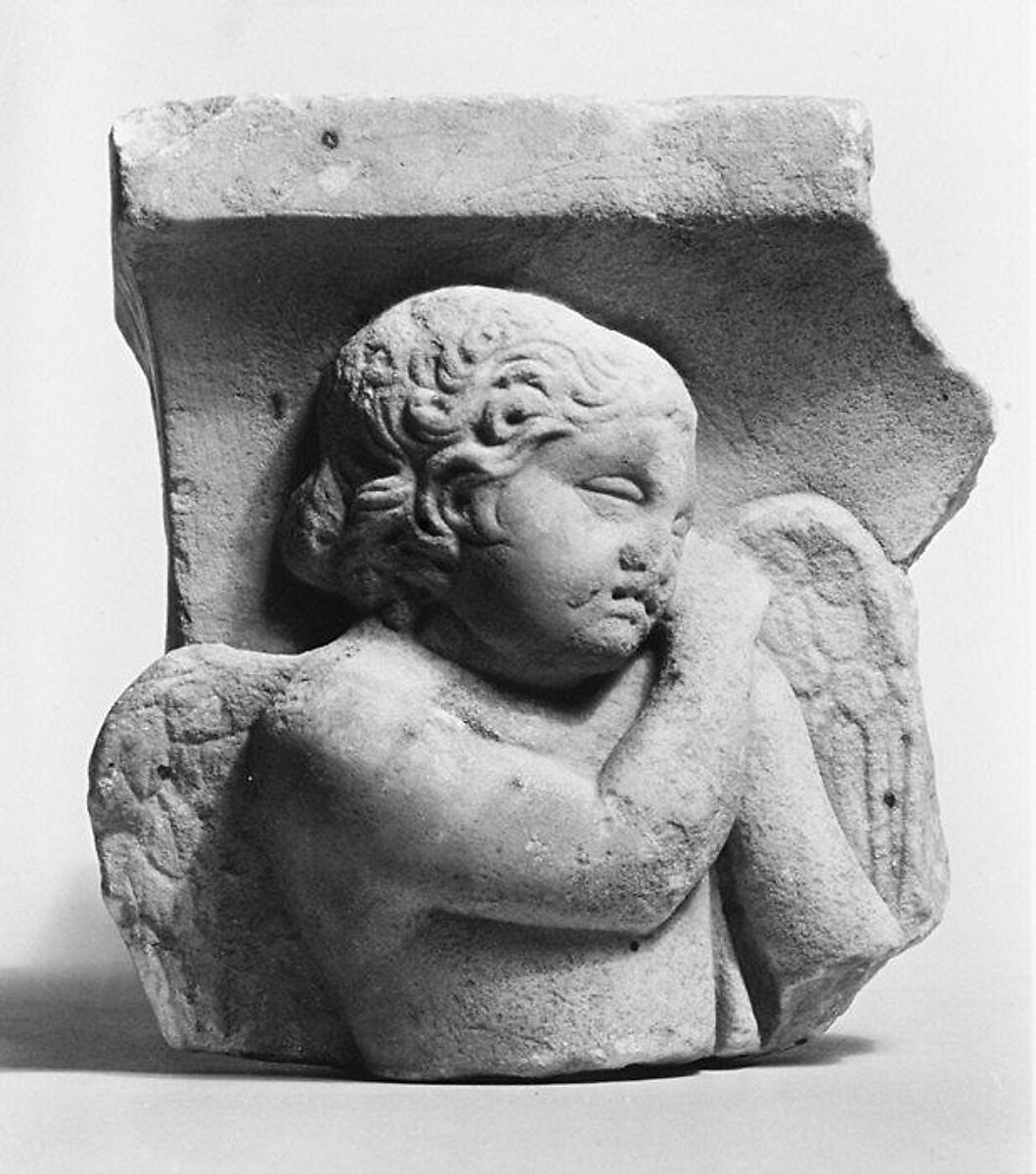 Marble sarcophagus fragment: Eros leaning on a reversed torch, Marble-Luni, Roman