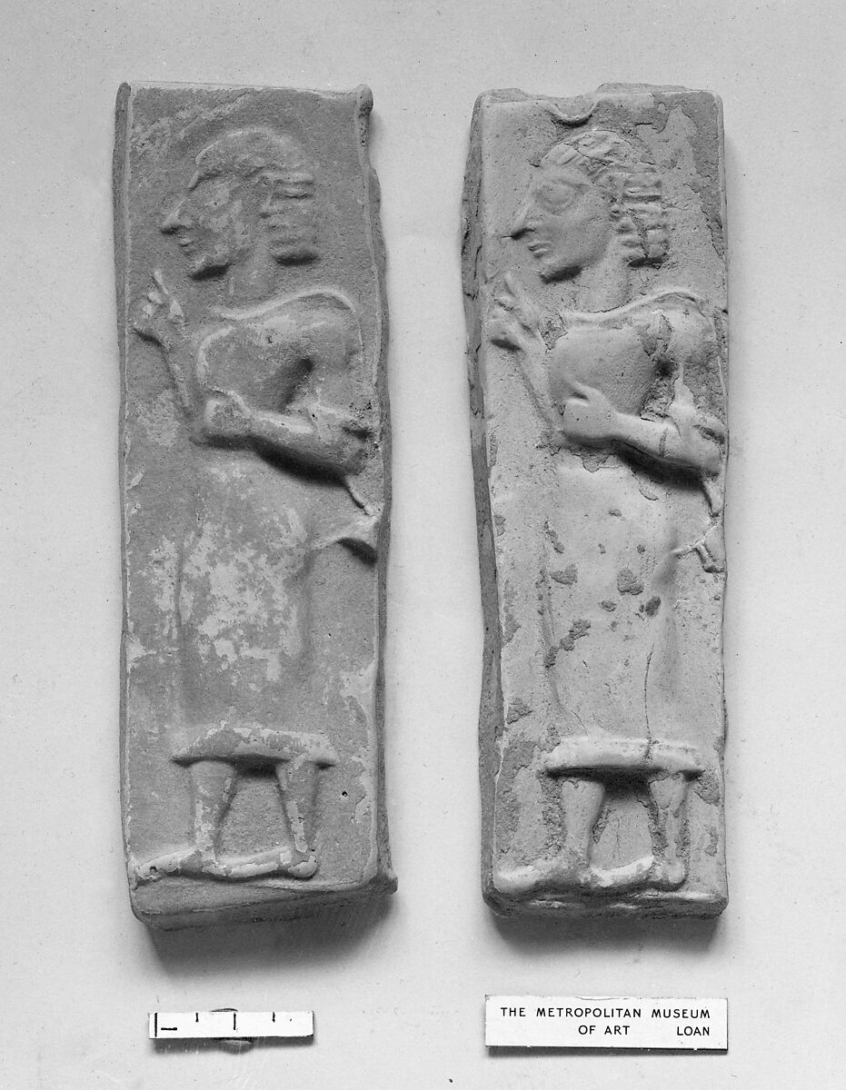 Terracotta plaque with a striding male figure, Terracotta, Greek, Cretan 