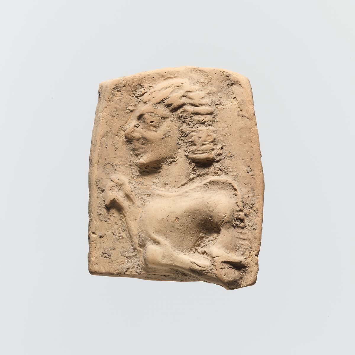 Fragment of a terracotta plaque, Terracotta, Greek, Cretan 