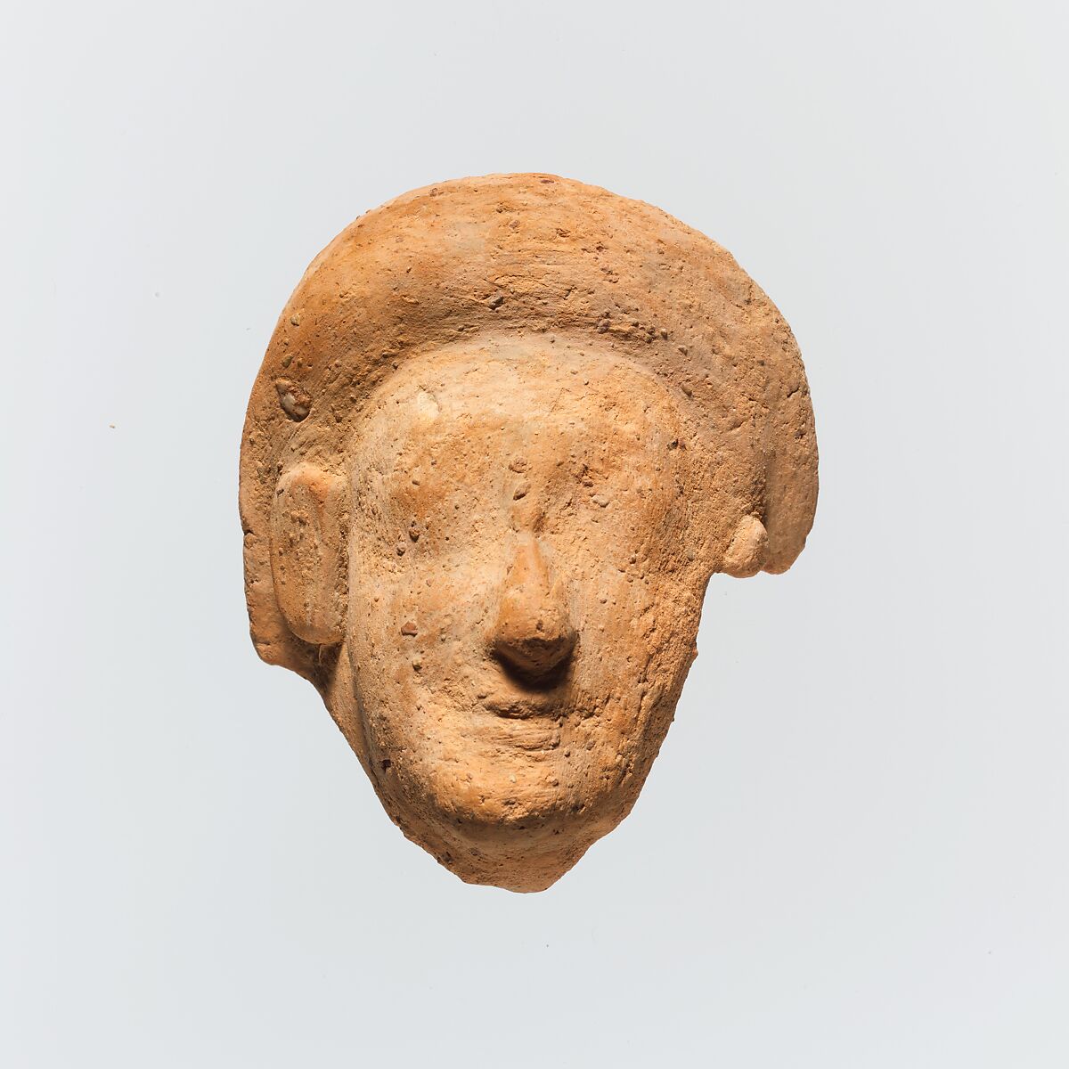 Terracotta fragment of a woman's head, Terracotta, Greek, Cretan 