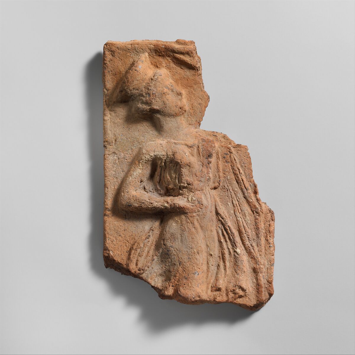Fragment of a terracotta plaque, Terracotta, Greek 