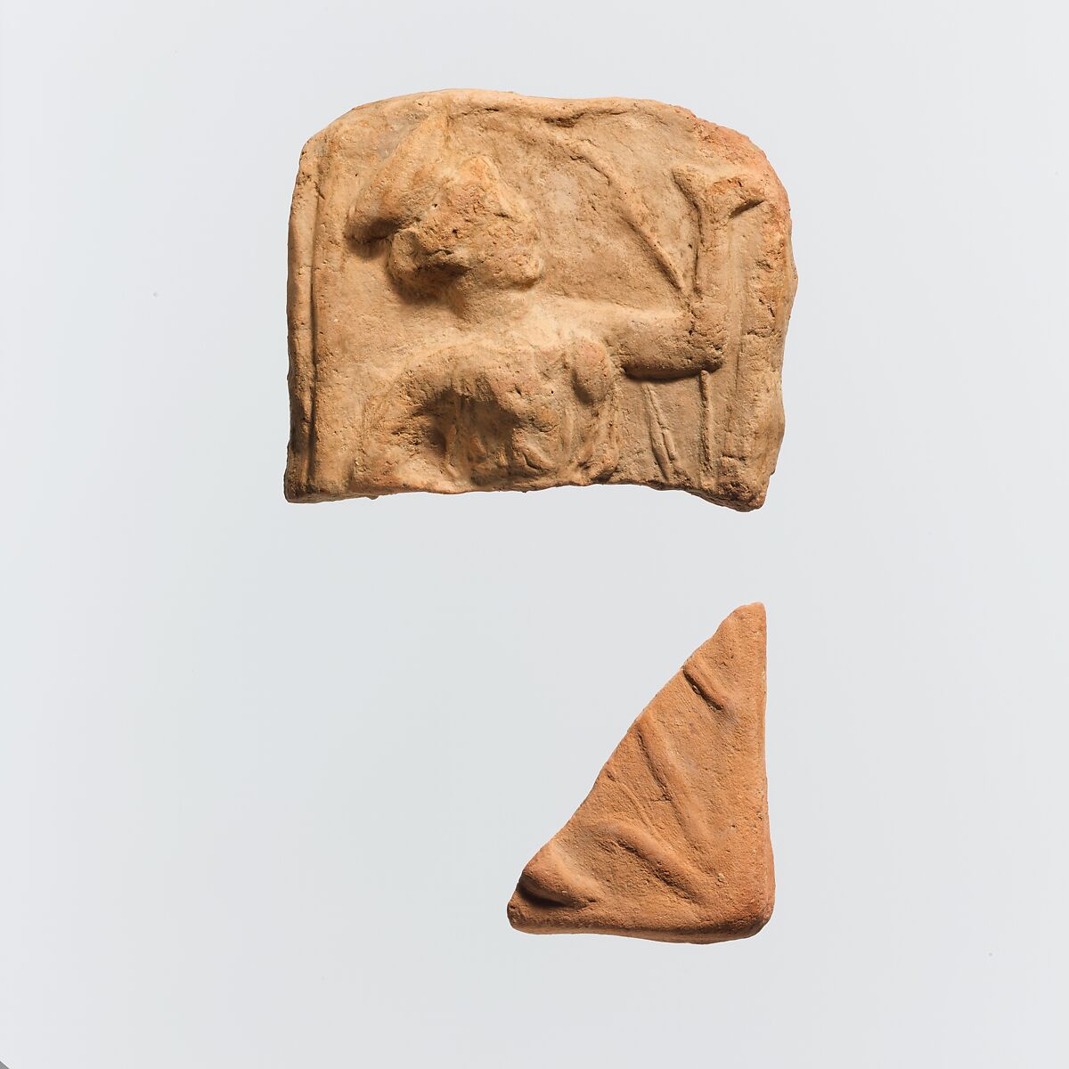 Two fragments of a terracotta plaque, Terracotta, Greek 