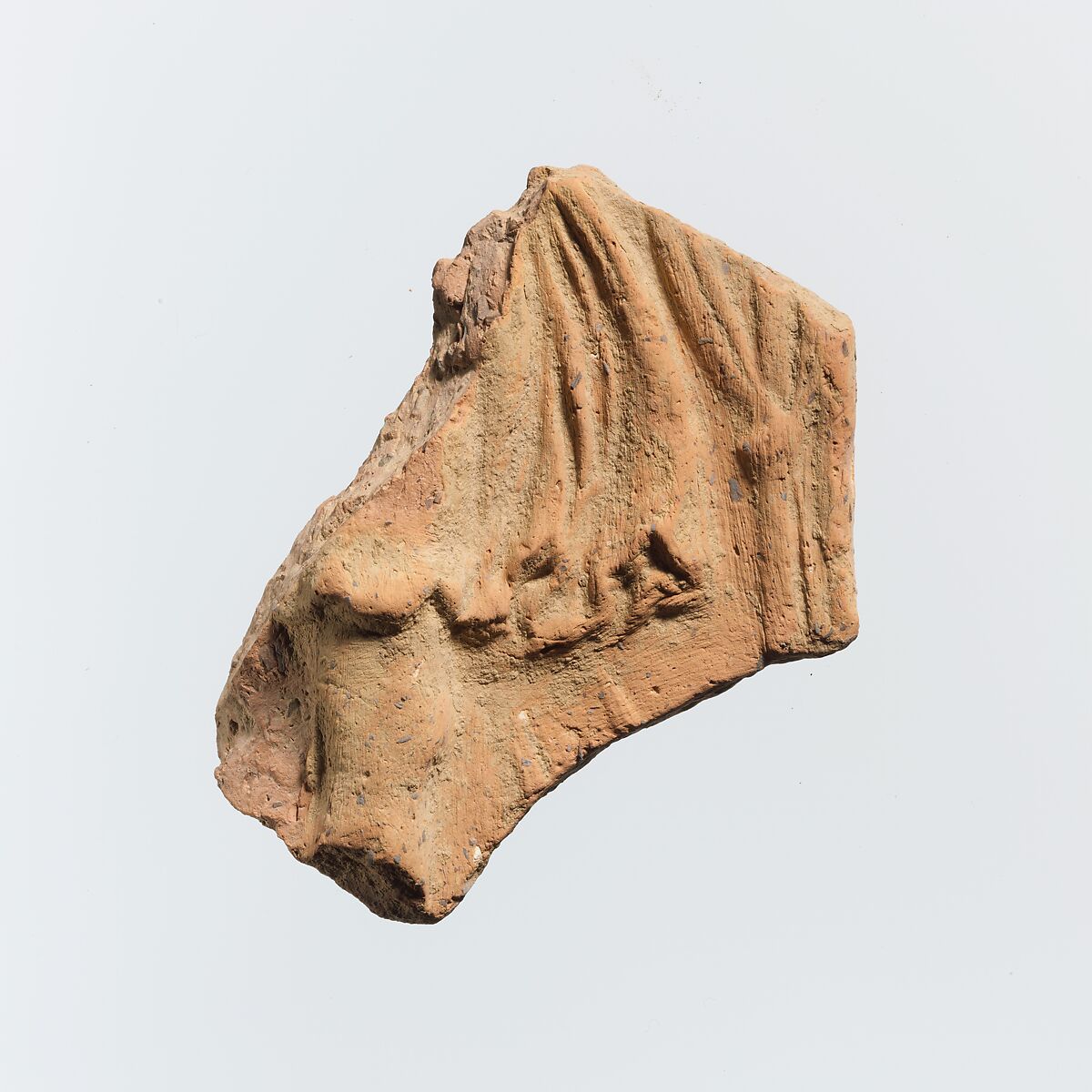 Fragment of a terracotta plaque, Terracotta, Greek 
