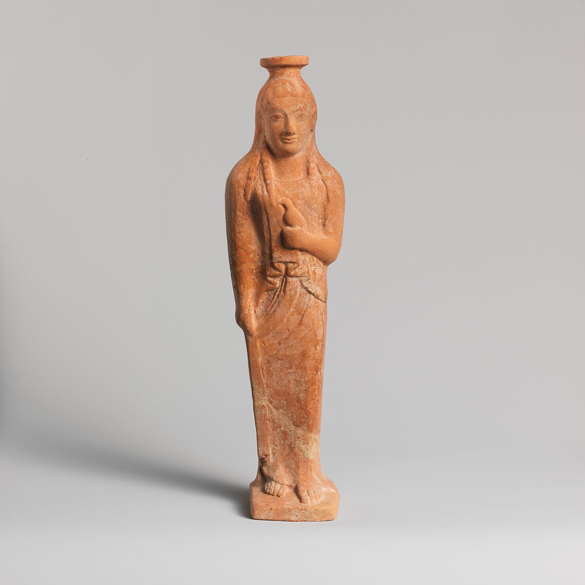 Terracotta vase in the form of a woman holding a bird, Terracotta, East Greek 