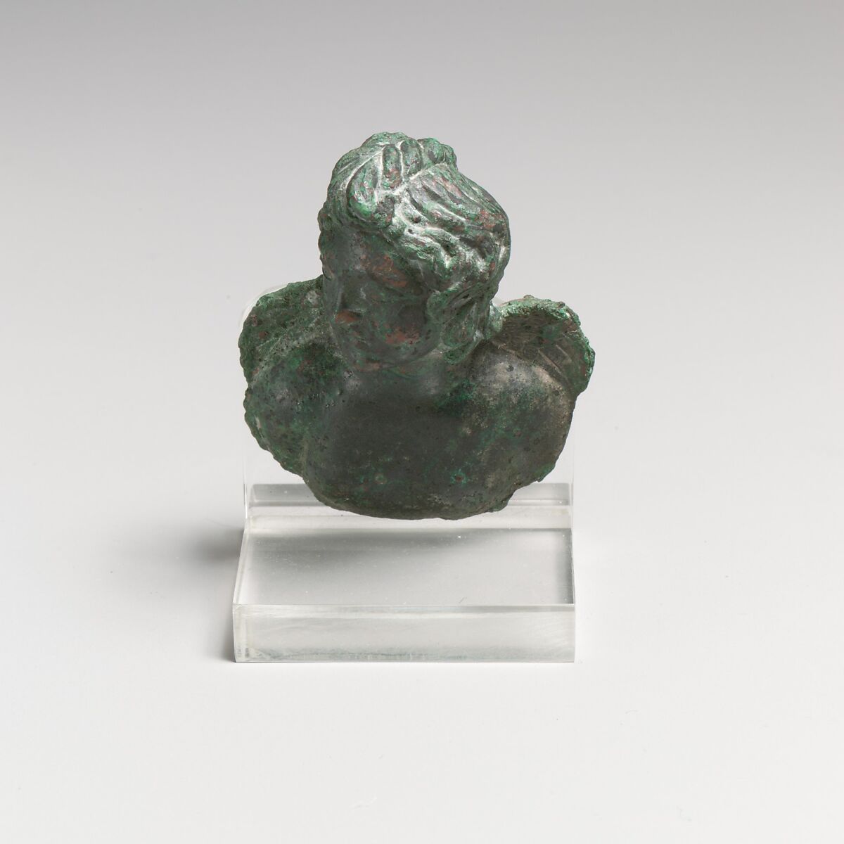 Bronze fulcrum attachment with a bust of Eros, Bronze, Roman 