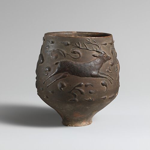 Terracotta cup with barbotine decoration