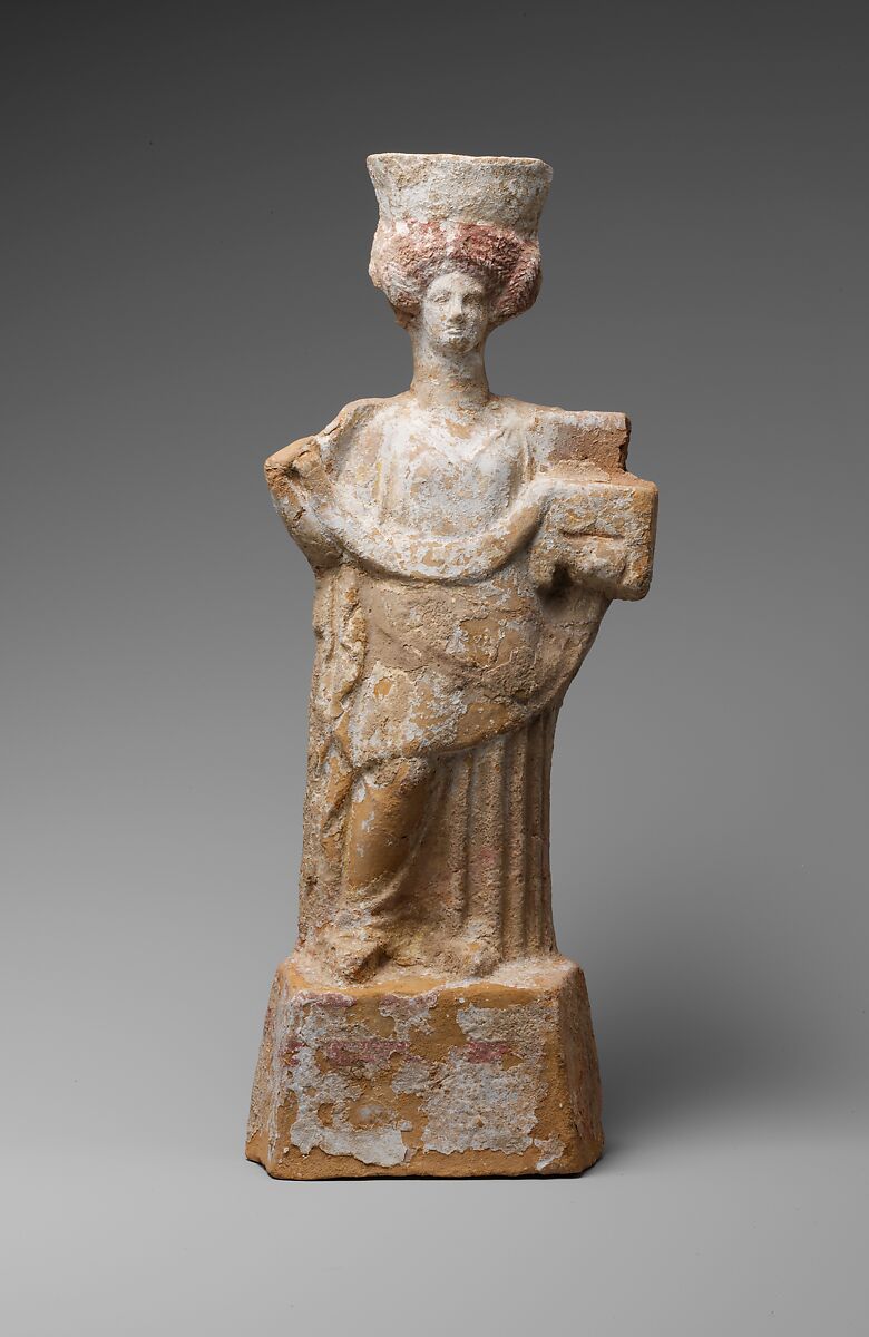 Terracotta statuette of a standing woman with a basket and wreath, Terracotta, Greek, Boeotian 